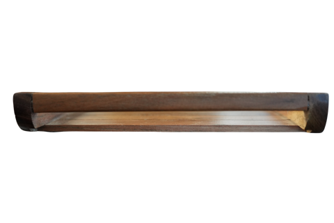 Long, narrow wooden object with a dark brown exterior and light interior on a white background