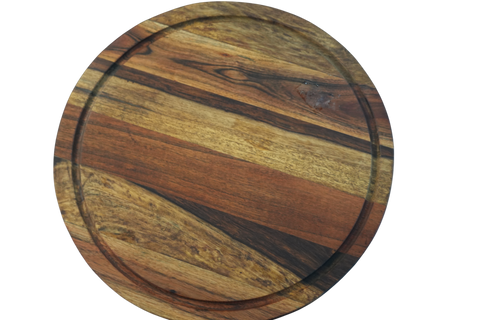 Round wooden cutting board with a multicolored grain pattern on a white background